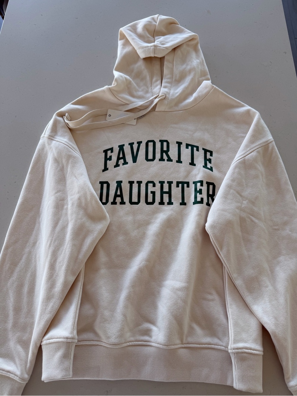 Favorite Daughter Cream Hoodie with Dark Green Lettering